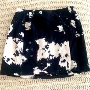 Cow print Urban Outfitters mini skirt with button details on front